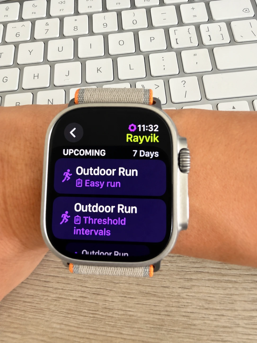 Apple Watch showing Rayvik’s upcoming easy run and threshold interval sessions in the Workout app